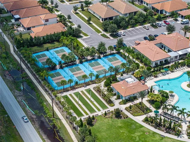 an aerial view of residential houses with outdoor space