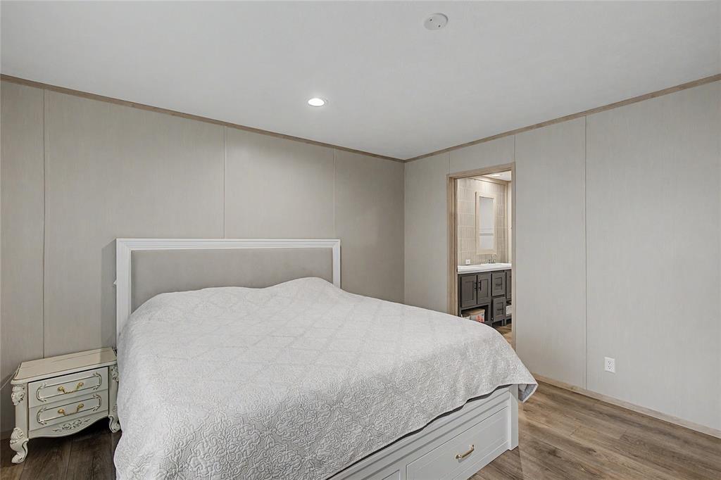 6065 Timber Trail Azle, TX 76020 - Photo 15 of 33 a large bed sitting in a bedroom and room