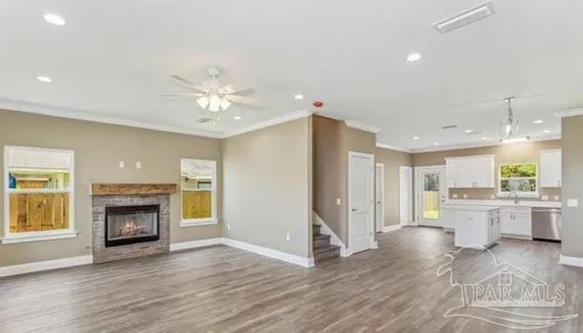a view of kitchen with sink a microwave and refrigerator
