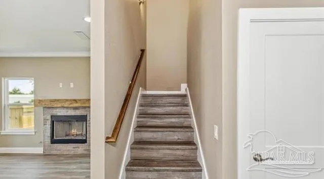 a view of staircase with white walls and a window