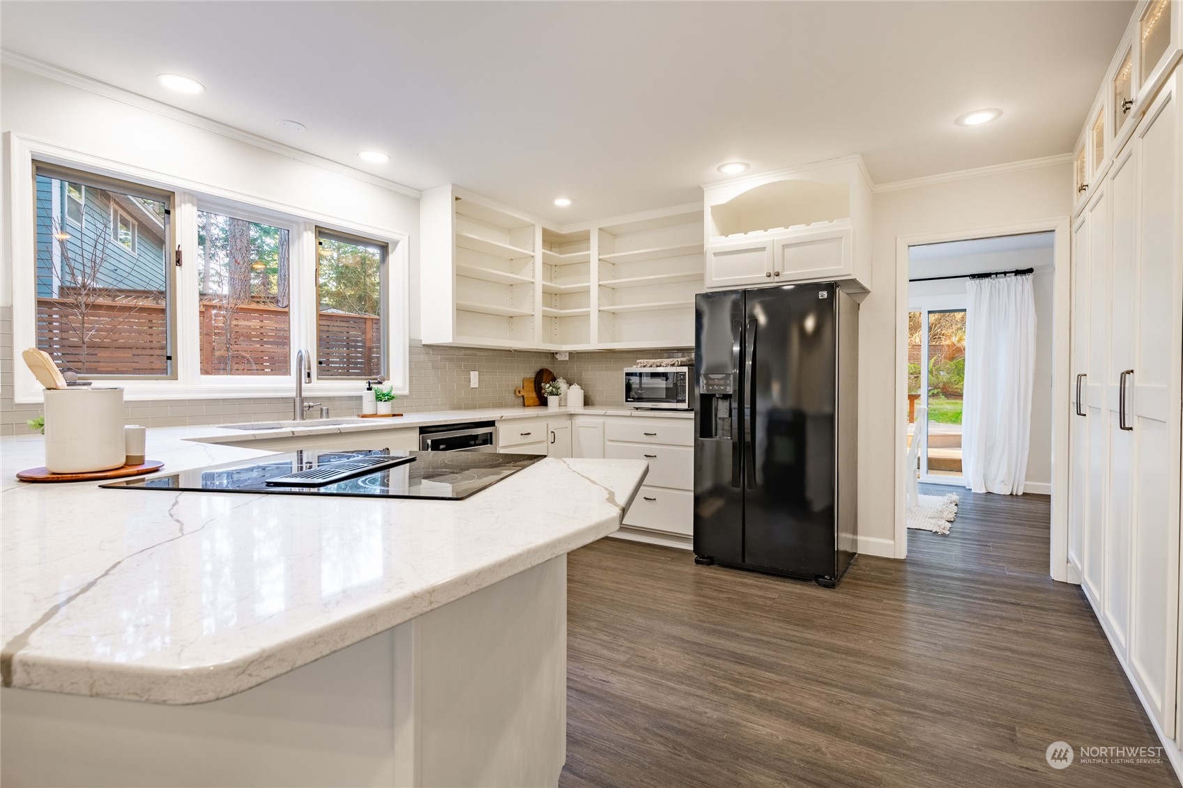 624 Clark Road Bellingham, WA 98225 - Photo 11 of 40 a kitchen with stainless steel appliances granite countertop a refrigerator a sink and a stove