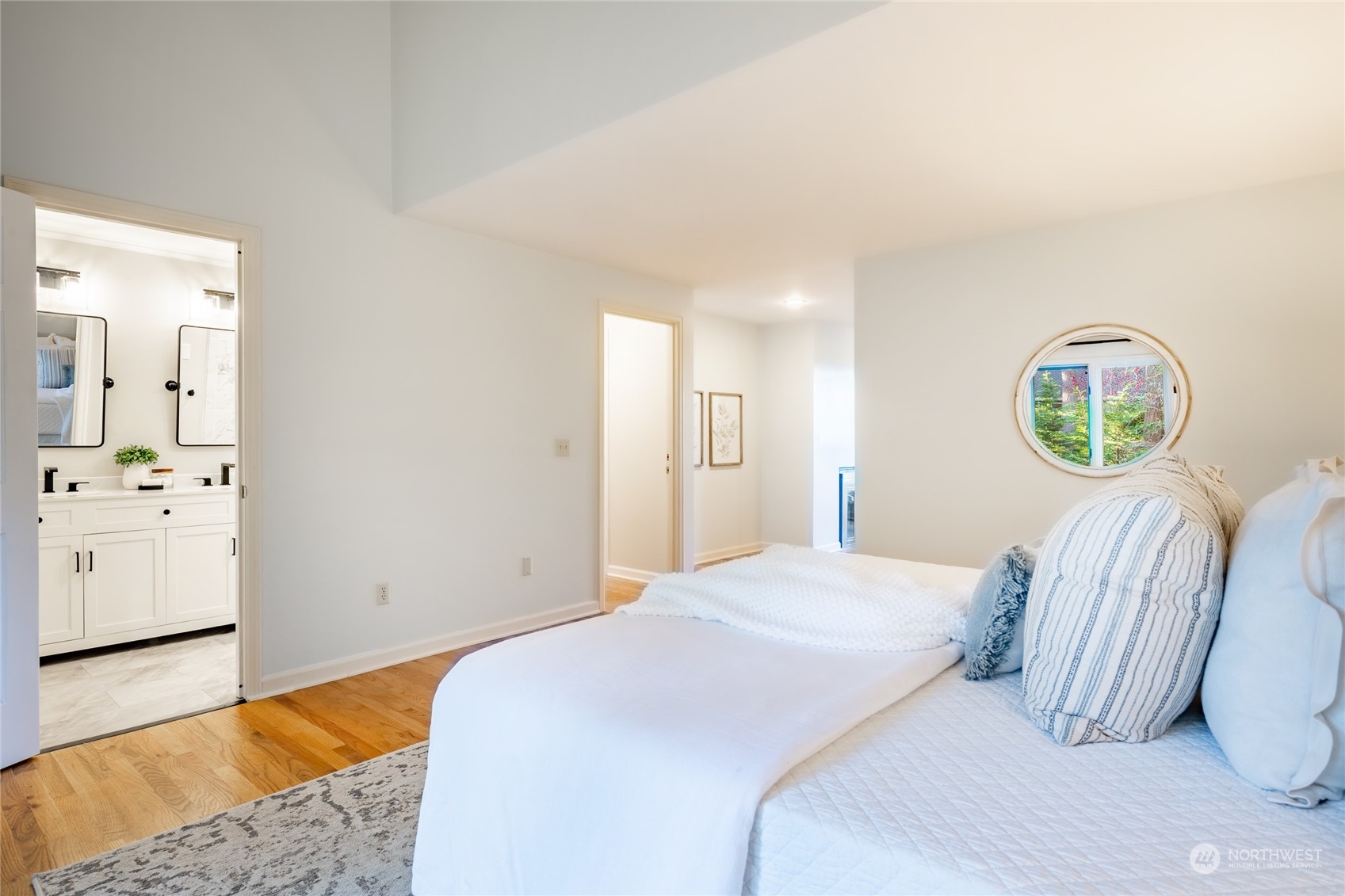 624 Clark Road Bellingham, WA 98225 - Photo 19 of 40 a bedroom with a bed and a chandelier