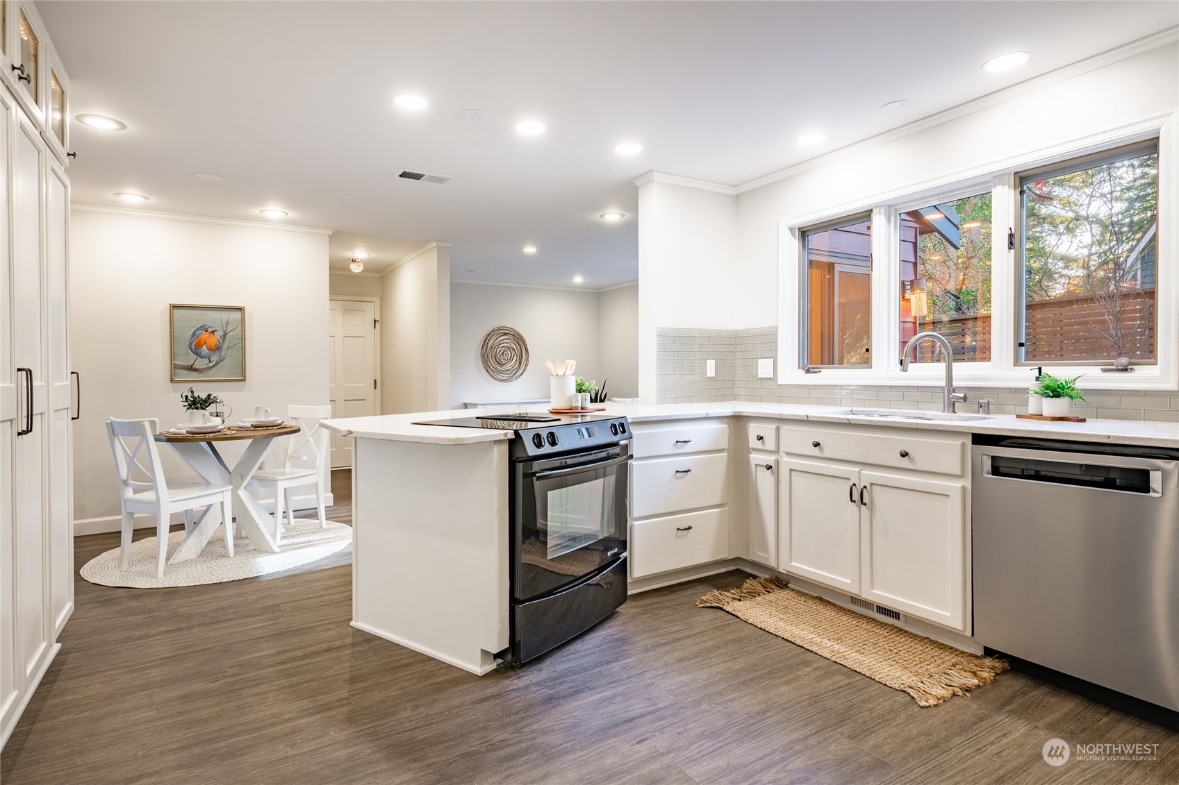 624 Clark Road Bellingham, WA 98225 - Photo 10 of 40 a kitchen with a sink cabinets and wooden floor