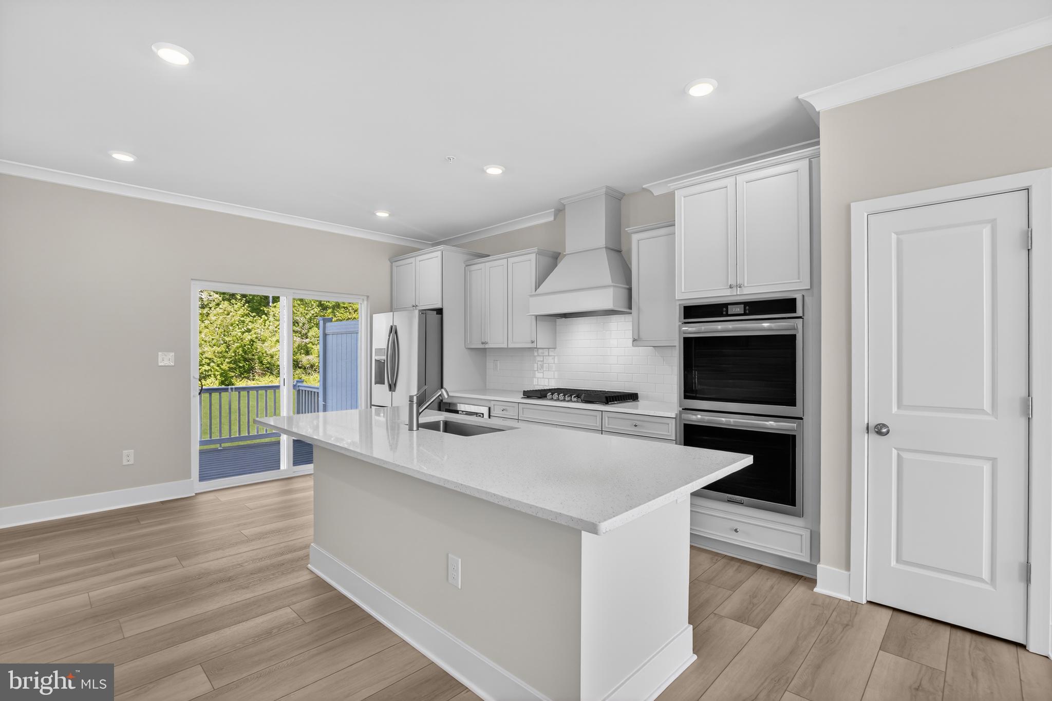 331 Hackley Drive Joppa, MD 21085 - Photo 3 of 18 a kitchen with a stove a sink and a refrigerator