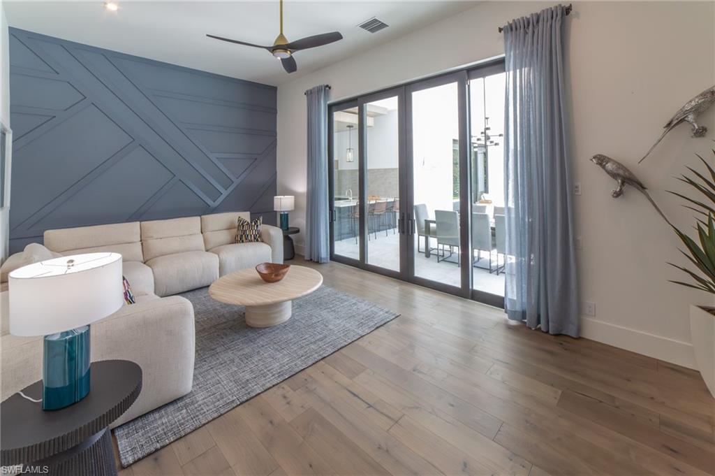 18 Caribbean Road Naples, FL 34108 - Photo 22 of 45 Bonus/Flex room featuring sliding doors that open to the outdoor kitchen