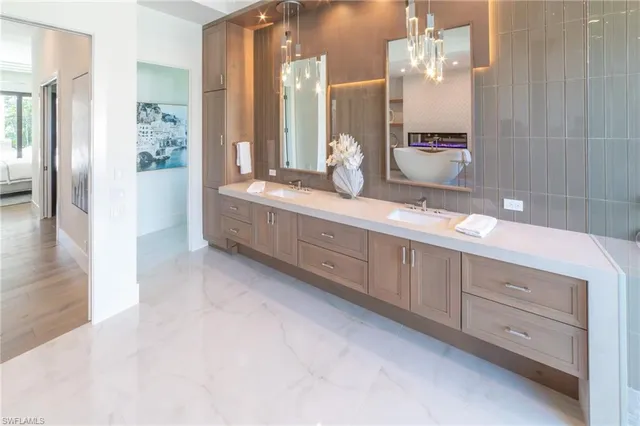 a bathroom with a double vanity sink and a mirror
