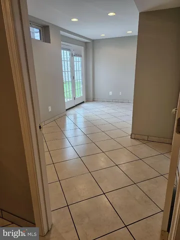 a view of an empty room and a window