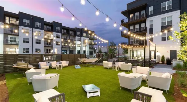 a view of a patio with couches and a table and chairs