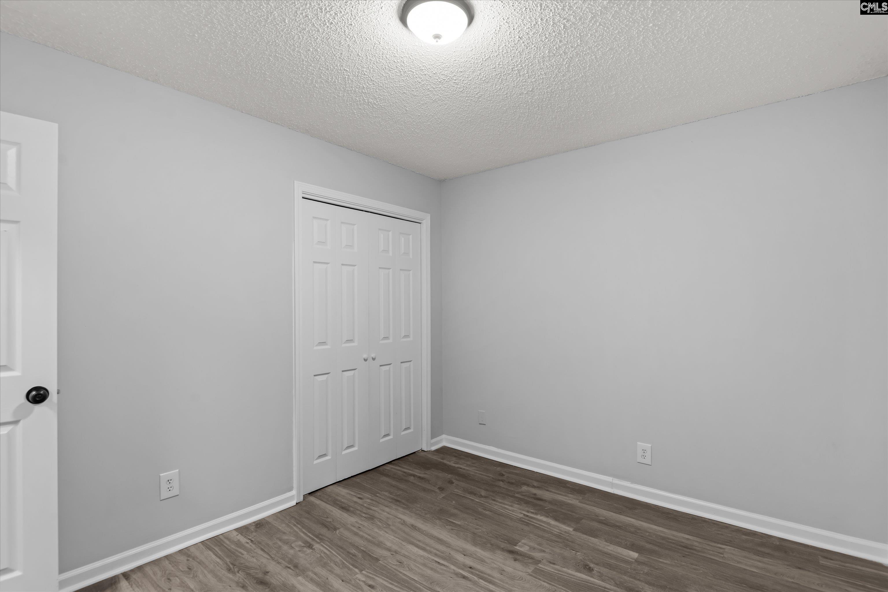 245 Piney Grove Road Columbia, SC 29210 - Photo 25 of 29 a view of an empty room with wooden floor