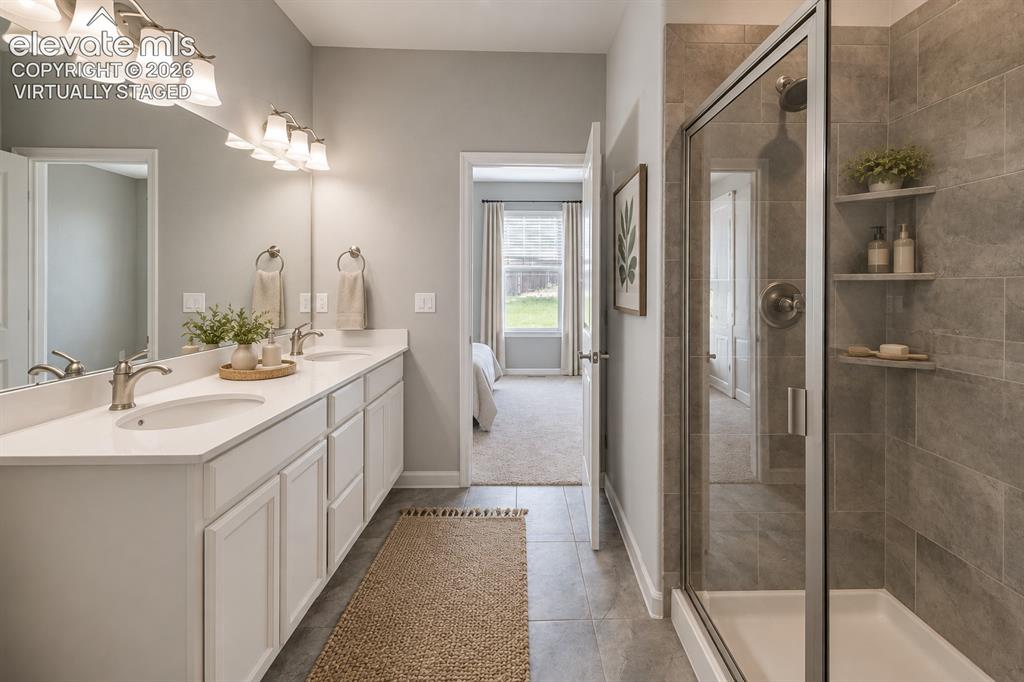 1306 Promontory Bluff View Colorado Springs, CO 80921 - Photo 27 of 39 Virtually staged main level master bath