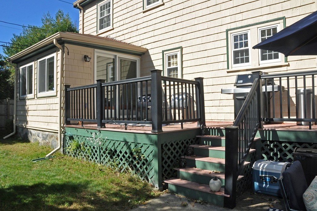 90 Martin Road Milton, MA 02186 - Photo 15 of 17 a front view of a house with a garden