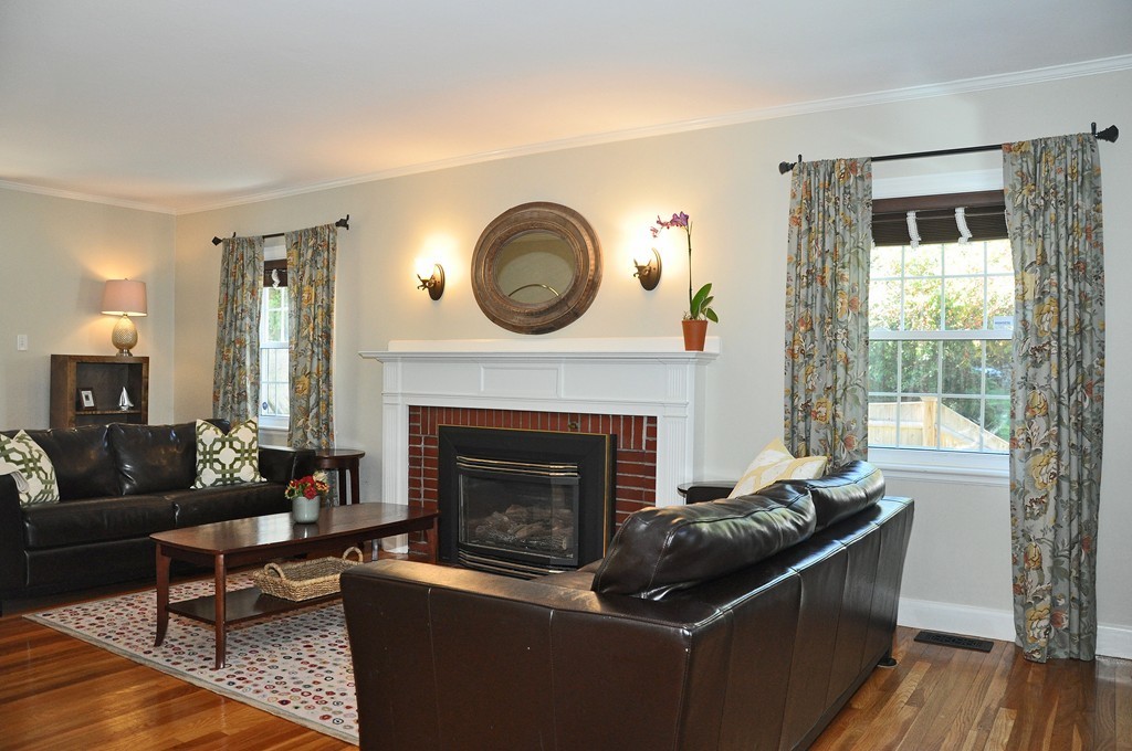 90 Martin Road Milton, MA 02186 - Photo 3 of 17 a living room with furniture and a fireplace
