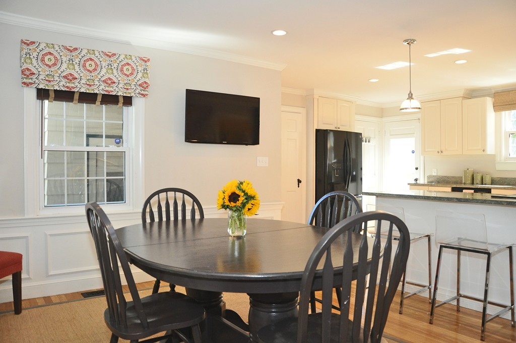 90 Martin Road Milton, MA 02186 - Photo 4 of 17 a view of a a dining room with furniture window and wooden floor