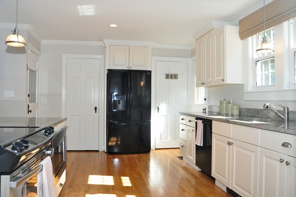 90 Martin Road Milton, MA 02186 - Photo 5 of 17 a kitchen with a refrigerator stove and sink