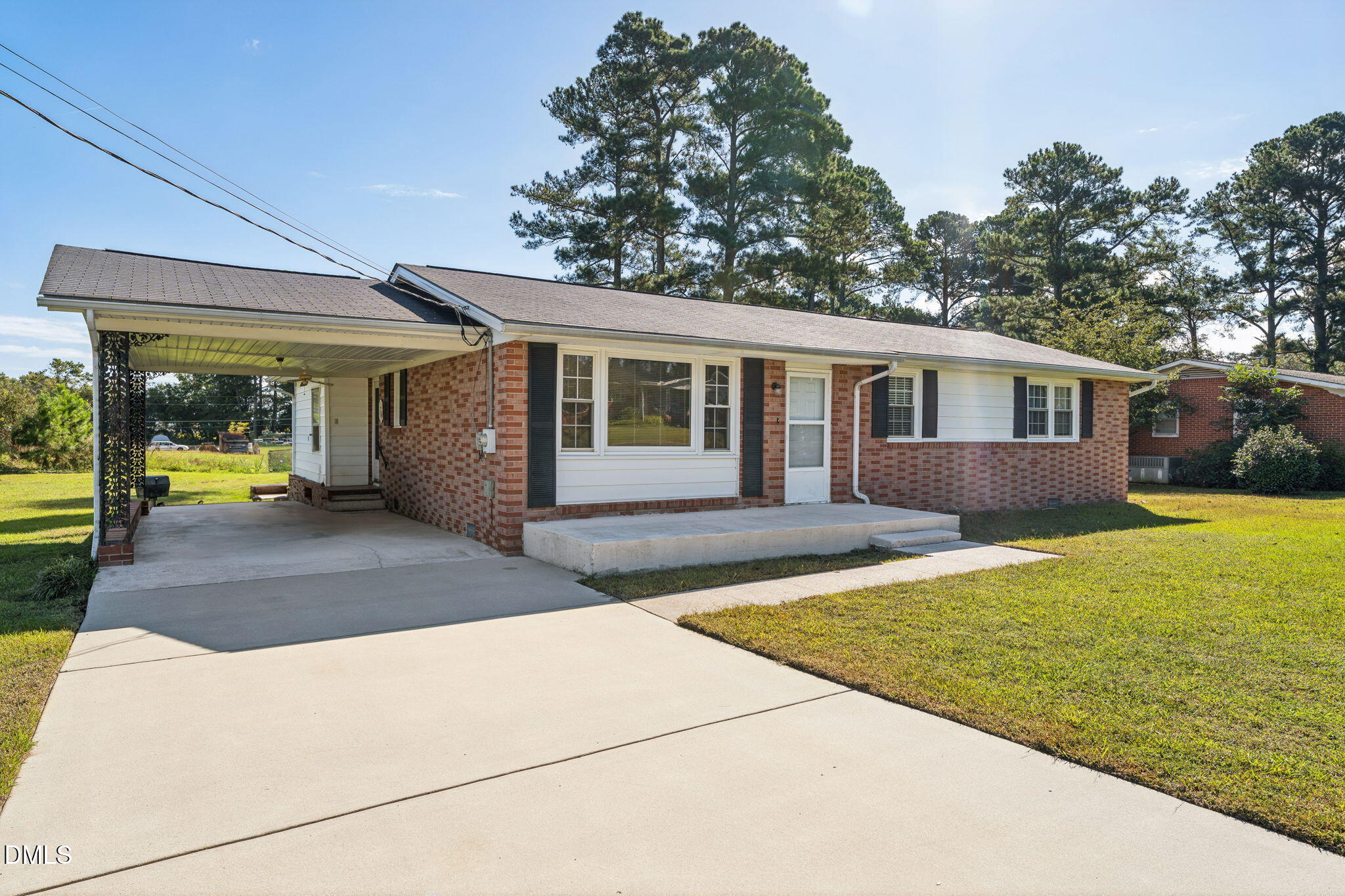 149 Fairview Village Road Dunn, NC 28334 - Photo 1 of 22 a view of a house with backyard and sitting area