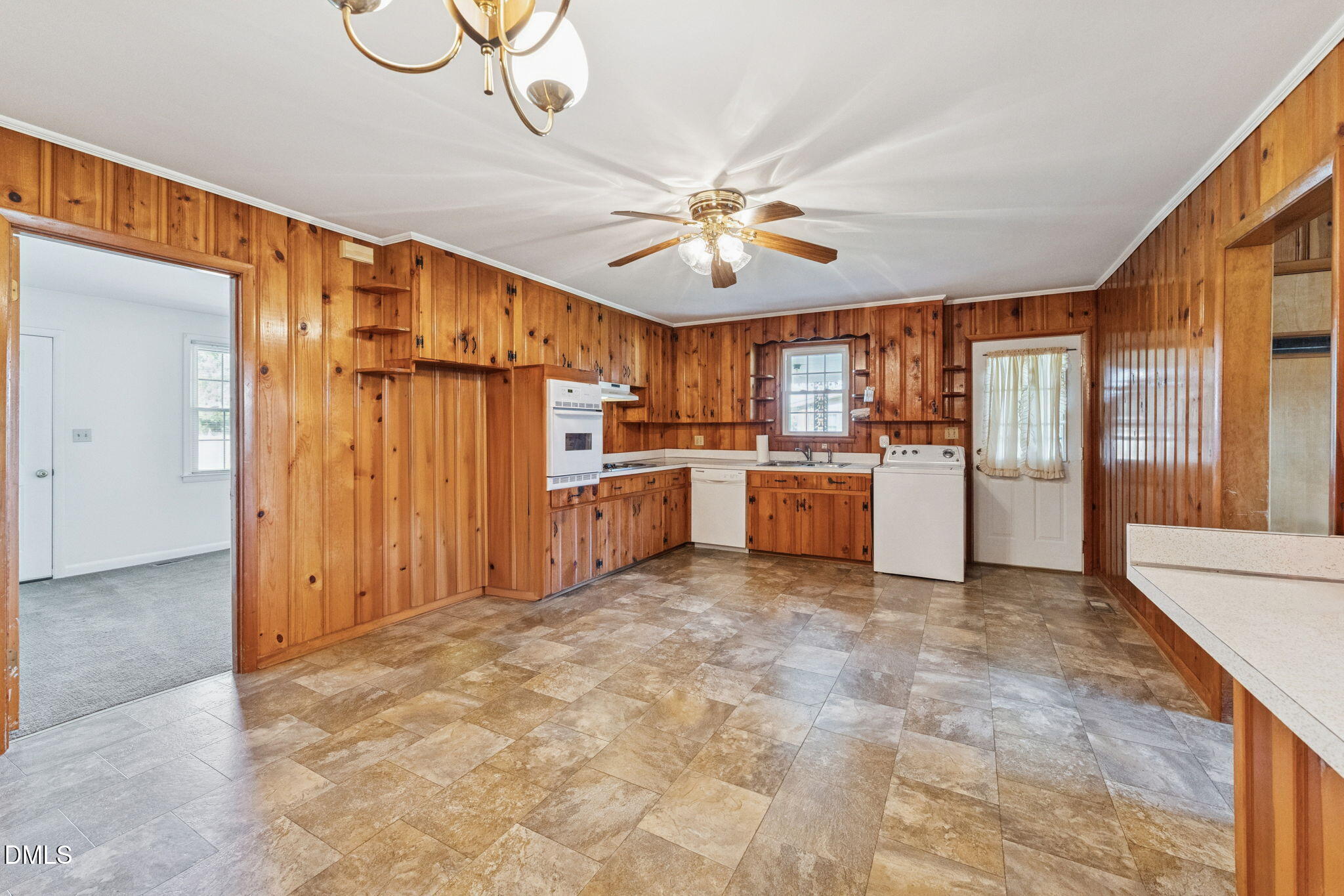 149 Fairview Village Road Dunn, NC 28334 - Photo 20 of 22 a view of a kitchen with a microwave and a refrigerator