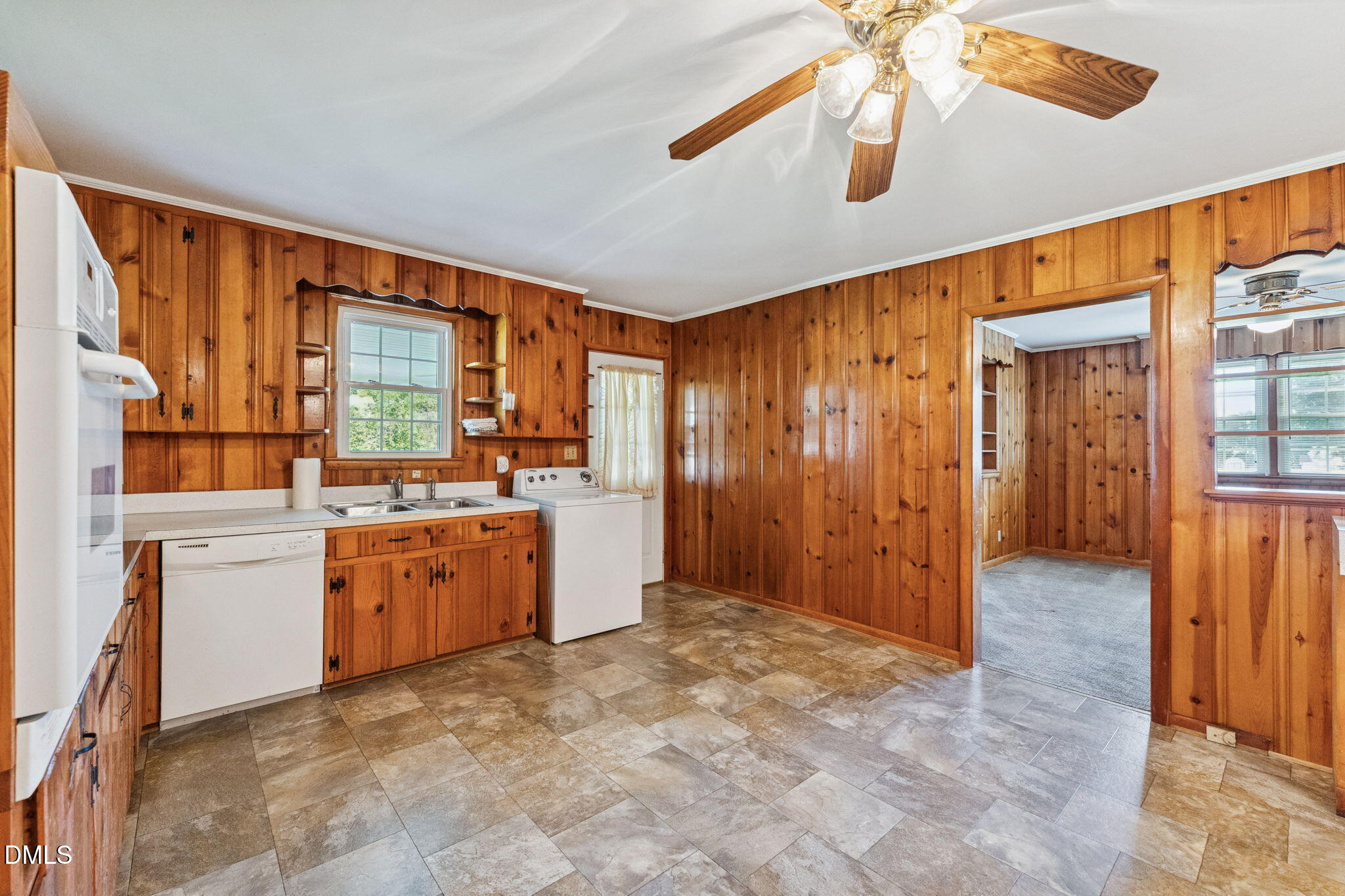 149 Fairview Village Road Dunn, NC 28334 - Photo 22 of 22 a view of a kitchen with refrigerator and wooden floor