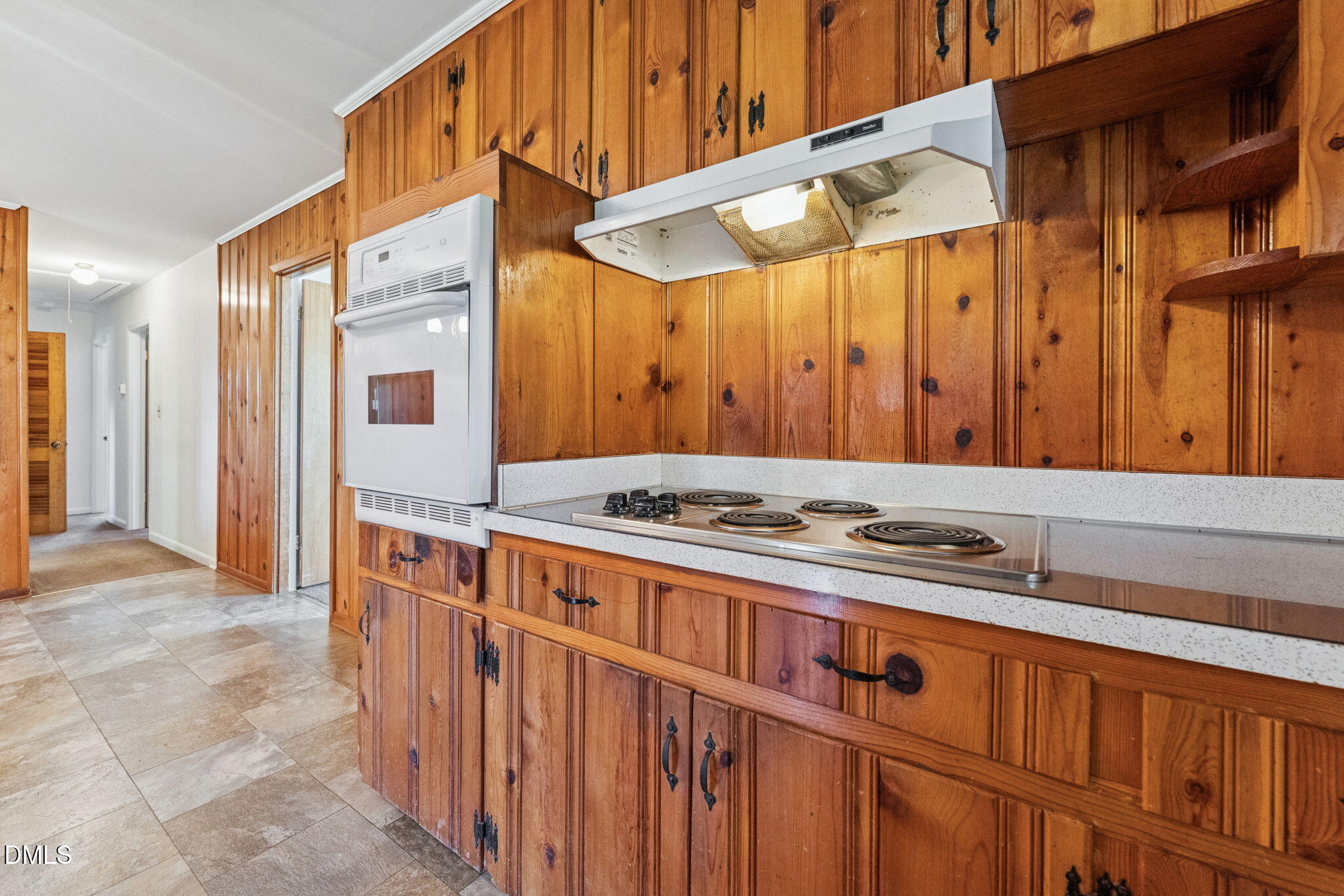 149 Fairview Village Road Dunn, NC 28334 - Photo 5 of 22 a utility room with stainless steel appliances a stove a sink and a refrigerator