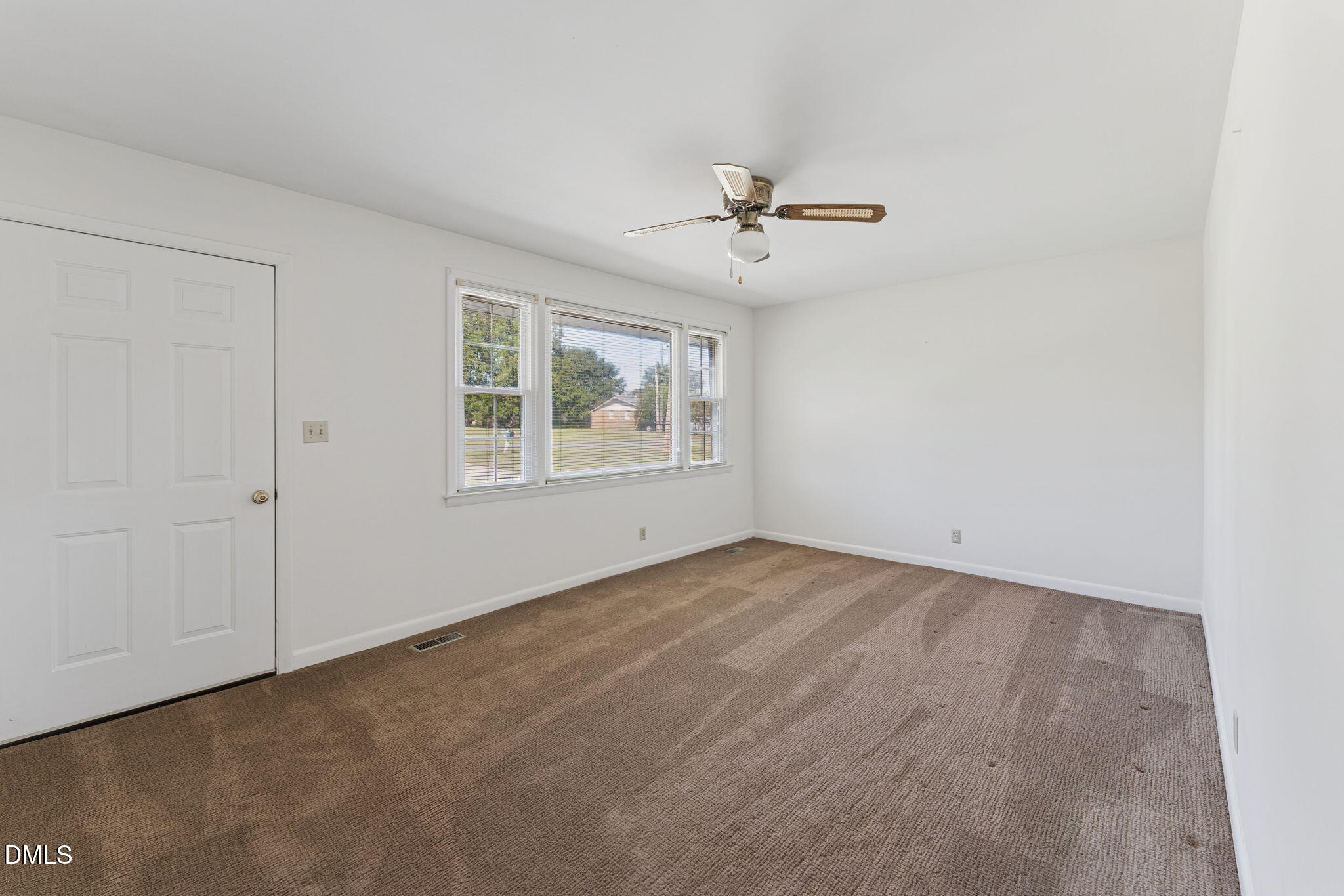 149 Fairview Village Road Dunn, NC 28334 - Photo 6 of 22 a view of an empty room with a window