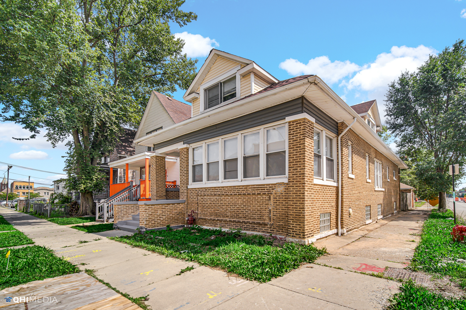 1 East 114th Street Chicago, IL 60628 - Photo 1 of 25 a front view of a house with a yard