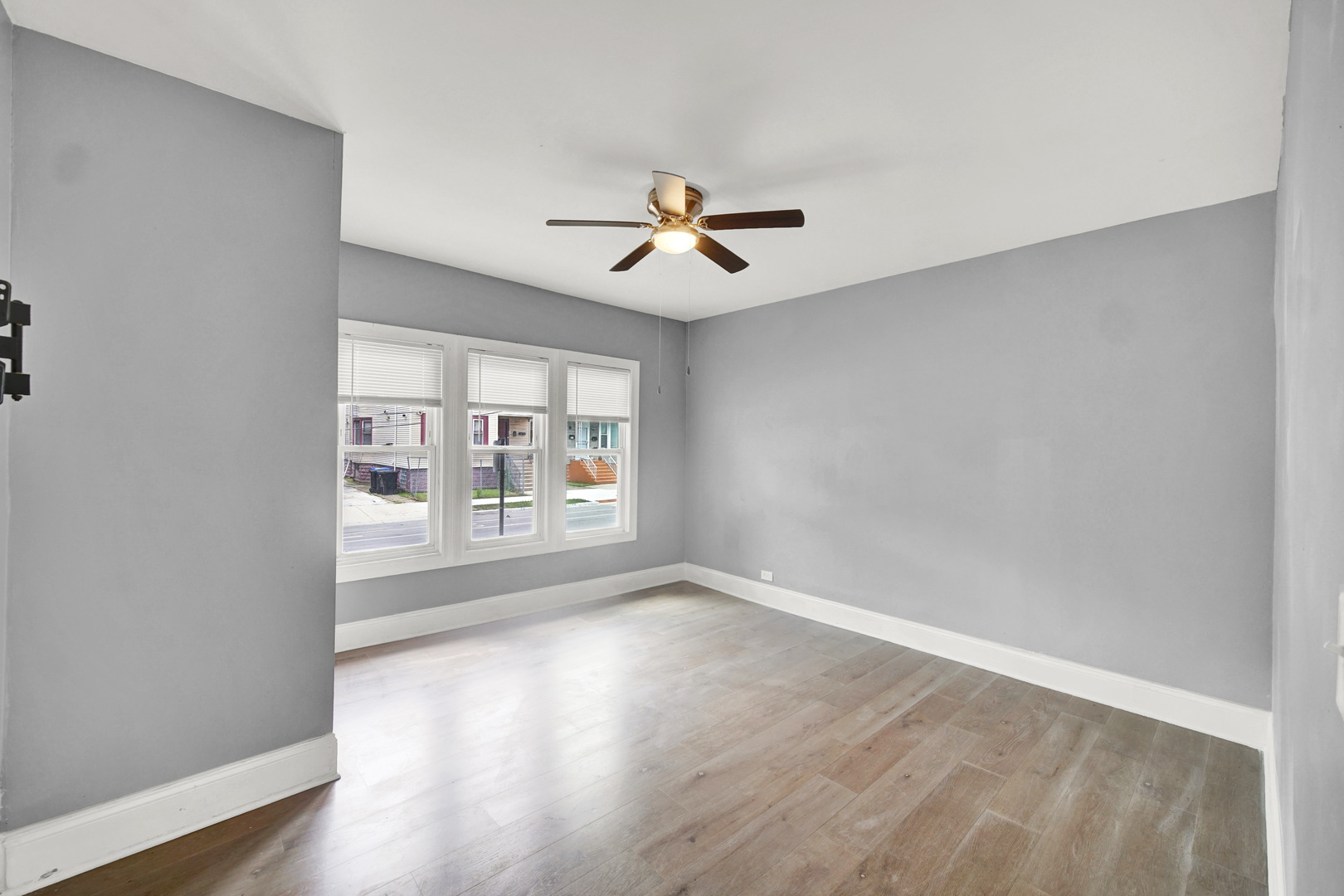 1 East 114th Street Chicago, IL 60628 - Photo 14 of 25 wooden floor in an empty room with a window