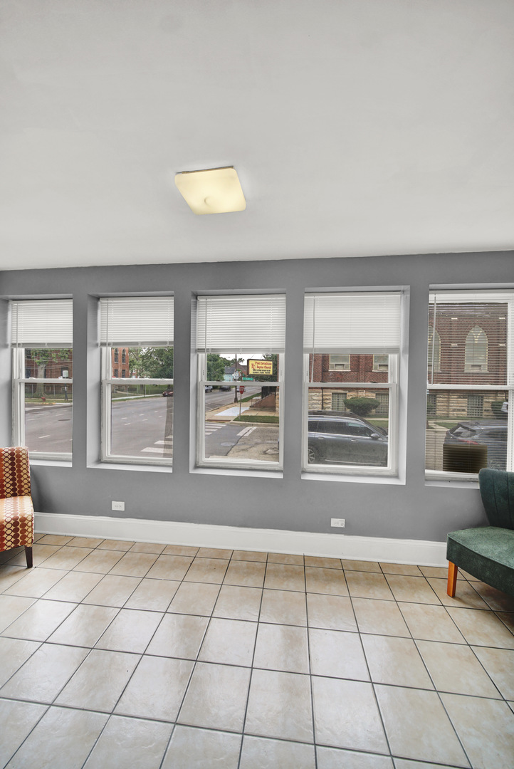 1 East 114th Street Chicago, IL 60628 - Photo 5 of 25 a view of an empty room with a window