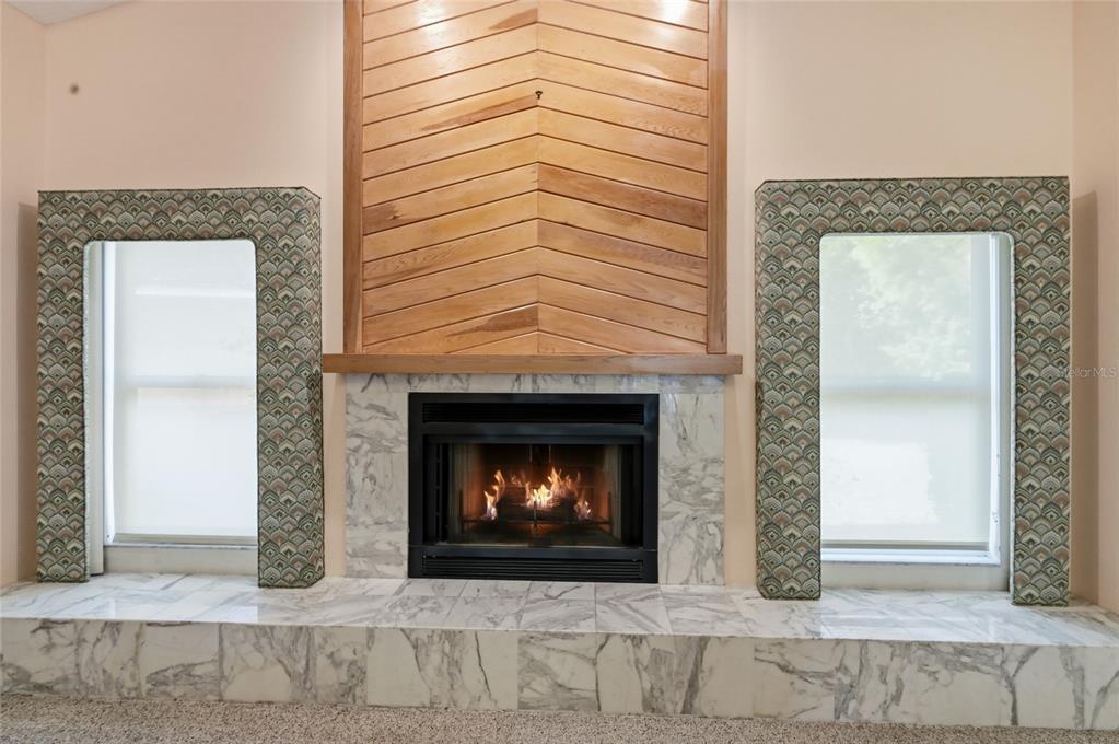 3732 Surrey Lane Sarasota, FL 34235 - Photo 12 of 35 a living room with a fireplace