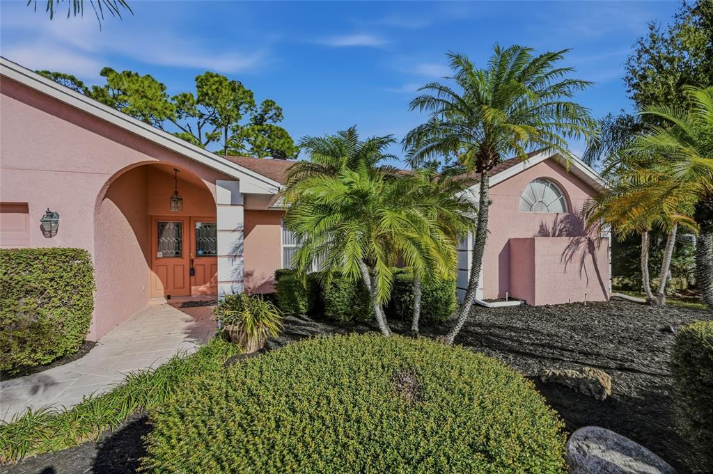 3732 Surrey Lane Sarasota, FL 34235 - Photo 2 of 35 a front view of a house with a yard