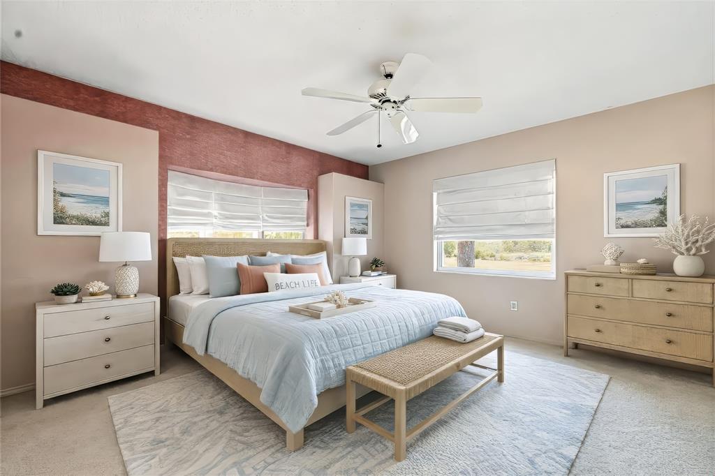 3732 Surrey Lane Sarasota, FL 34235 - Photo 22 of 35 a bedroom with a bed and a dresser
