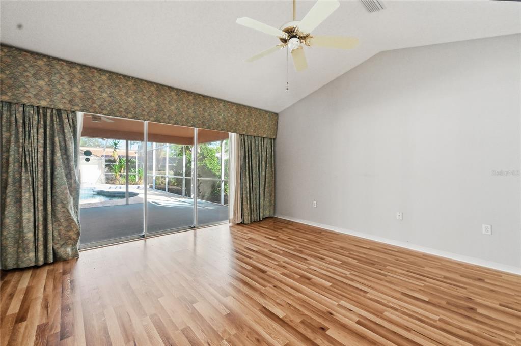3732 Surrey Lane Sarasota, FL 34235 - Photo 23 of 35 wooden floor in an empty room with a window