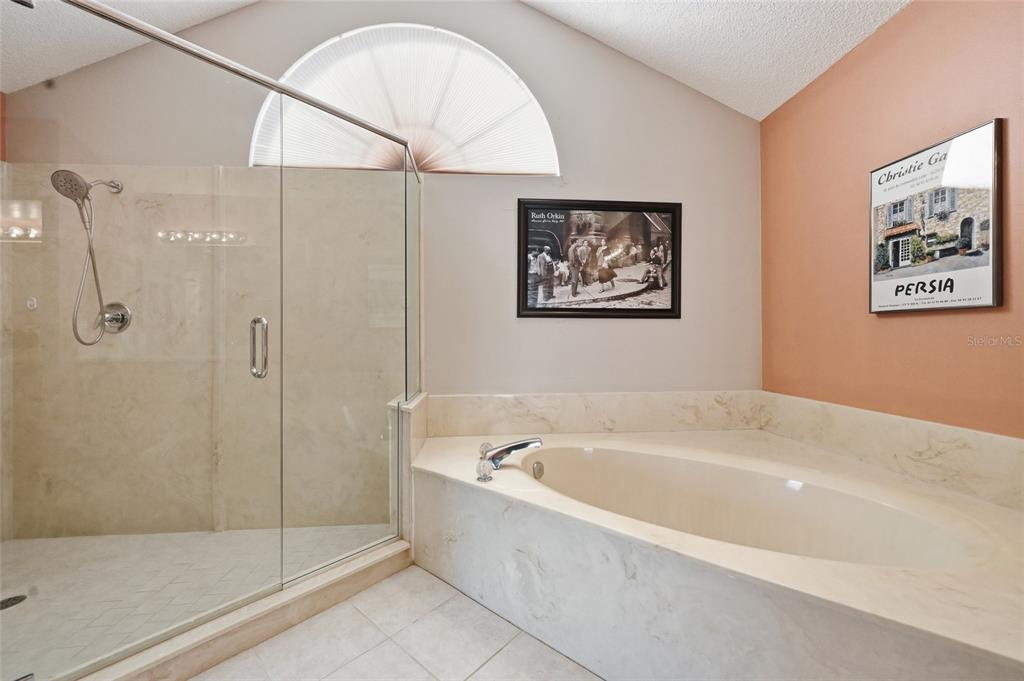 3732 Surrey Lane Sarasota, FL 34235 - Photo 28 of 35 a white bath tub sitting next to a shower