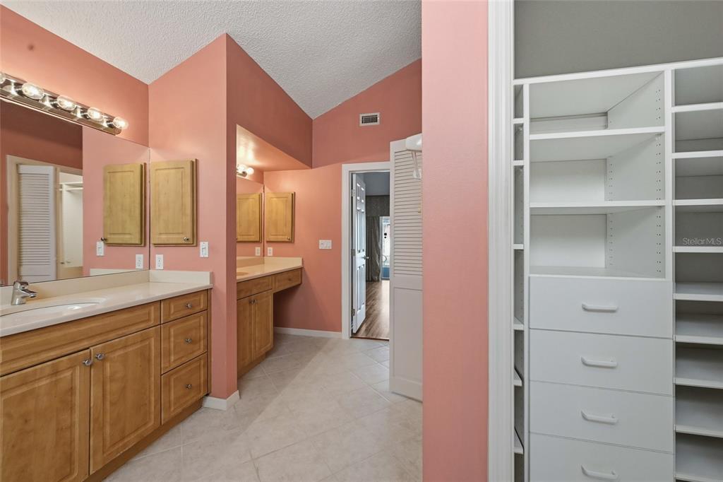 3732 Surrey Lane Sarasota, FL 34235 - Photo 29 of 35 a spacious bathroom with a granite countertop sink mirror and a shower