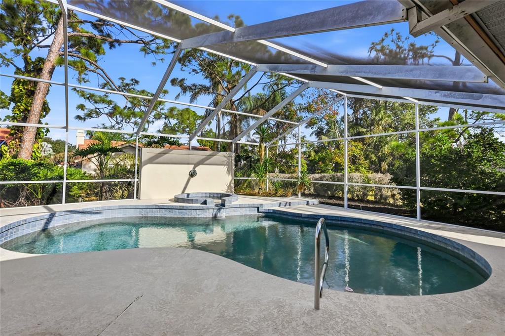 3732 Surrey Lane Sarasota, FL 34235 - Photo 31 of 35 a view of a swimming pool with a patio