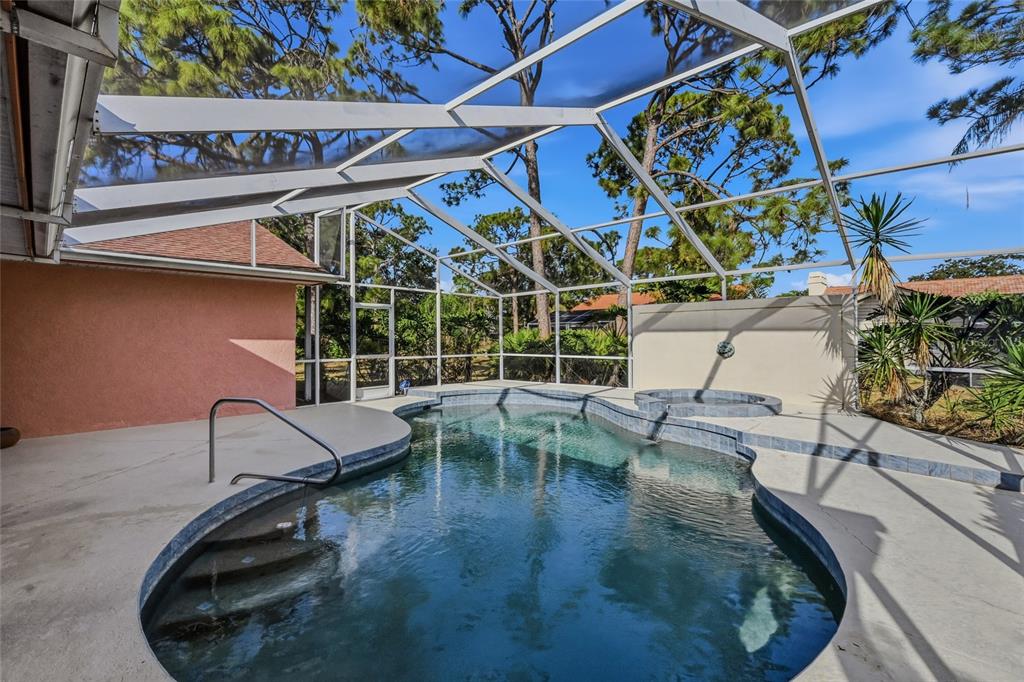 3732 Surrey Lane Sarasota, FL 34235 - Photo 33 of 35 a view of a chairs and table in patio with potted plants