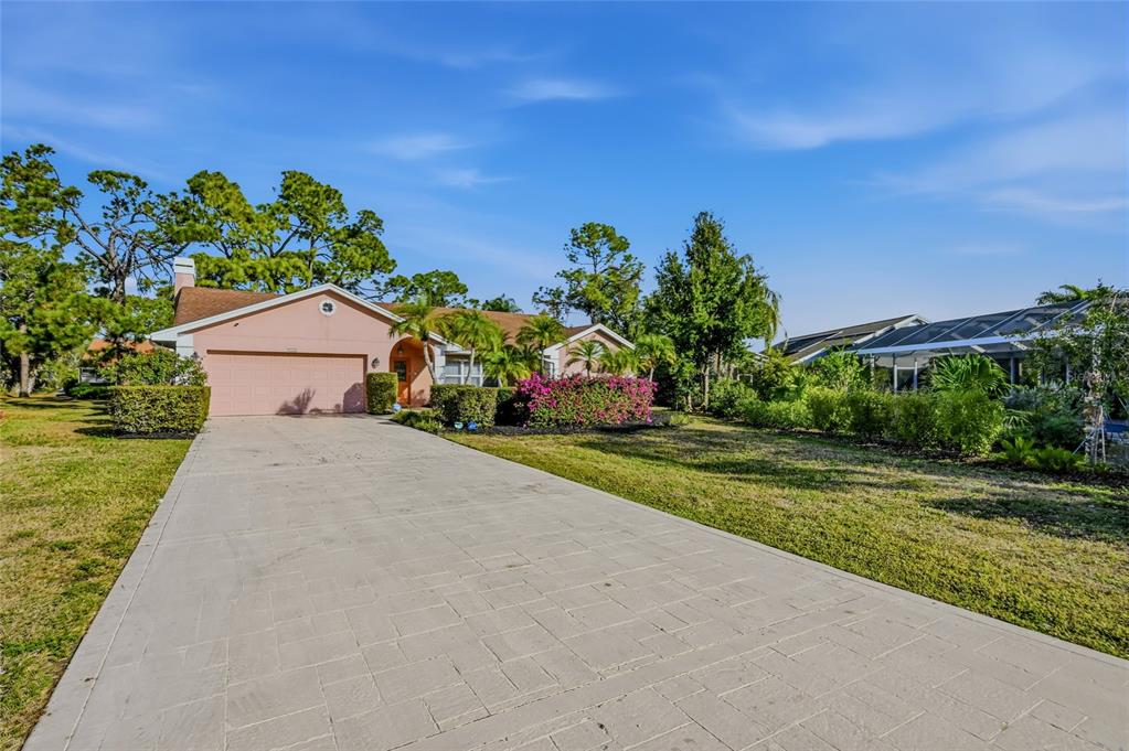 3732 Surrey Lane Sarasota, FL 34235 - Photo 35 of 35 a view of a house with a yard