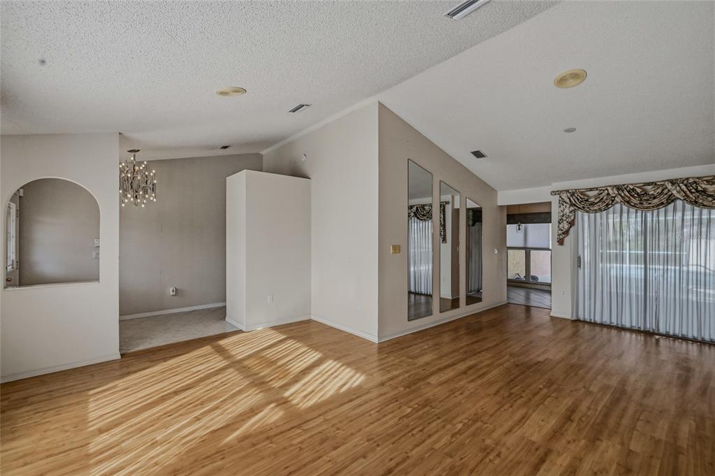 3732 Surrey Lane Sarasota, FL 34235 - Photo 4 of 35 a view of a livingroom with wooden floor