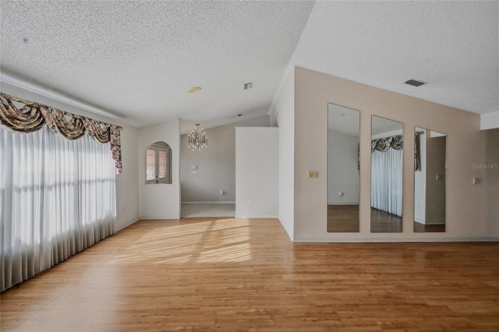 3732 Surrey Lane Sarasota, FL 34235 - Photo 5 of 35 a view of a hallway with a room