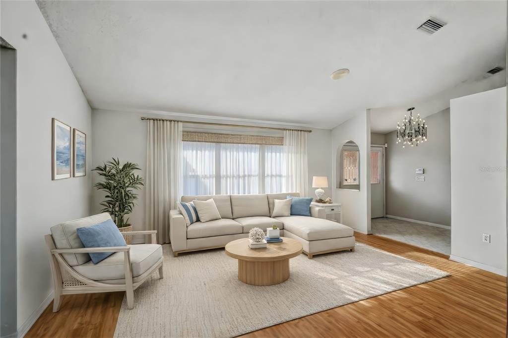 3732 Surrey Lane Sarasota, FL 34235 - Photo 6 of 35 a living room with furniture and a large window