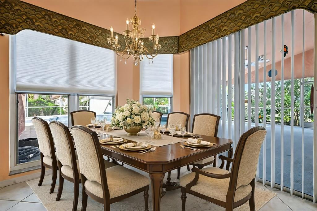 3732 Surrey Lane Sarasota, FL 34235 - Photo 8 of 35 a view of a dining room with furniture window and outside view