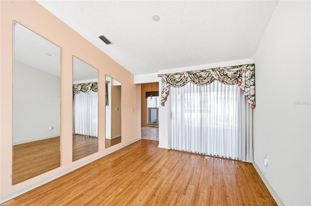 3732 Surrey Lane Sarasota, FL 34235 - Photo 10 of 35 a view of entryway with wooden floor