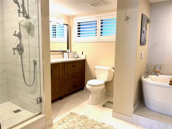 a bathroom with a toilet sink and shower