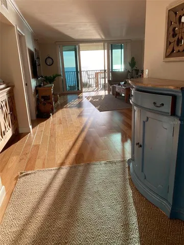 a bed room with a bed window and a television