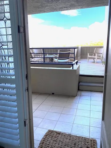 a view of table and chair in the balcony