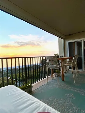 a view of a chairs and table in patio