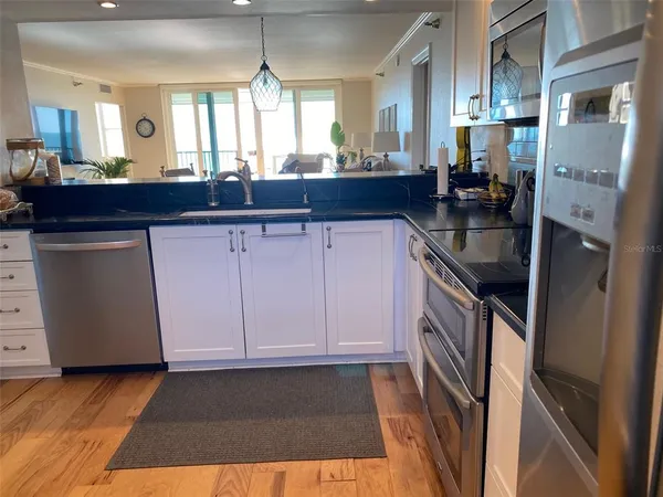 a kitchen with a sink and cabinets