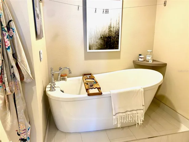 a white bath tub sitting in a bathroom