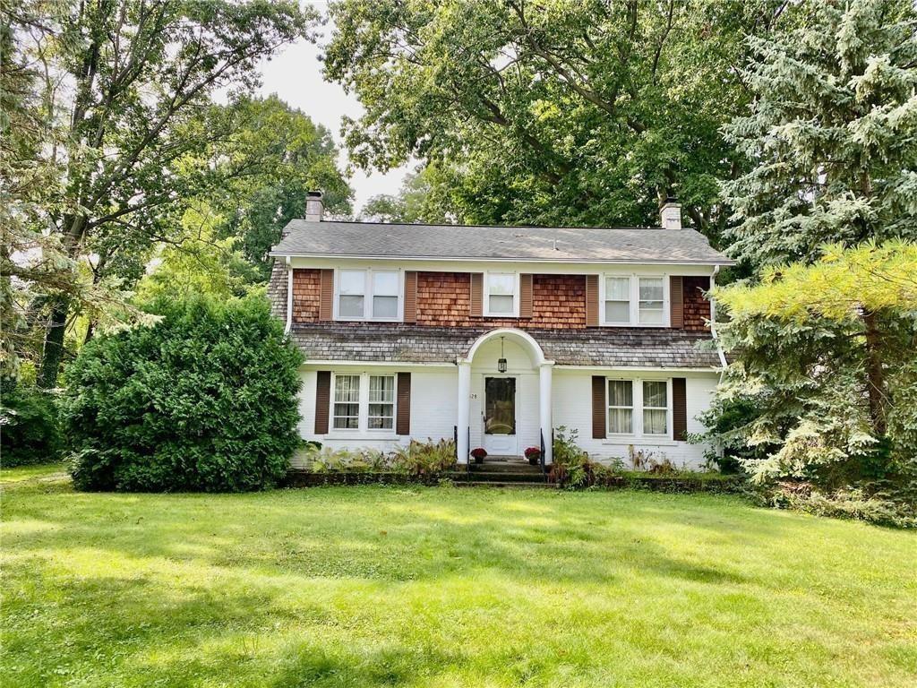 1828 Manchester Road Erie, PA 16505 - Photo 1 of 2 a front view of house with yard and green space