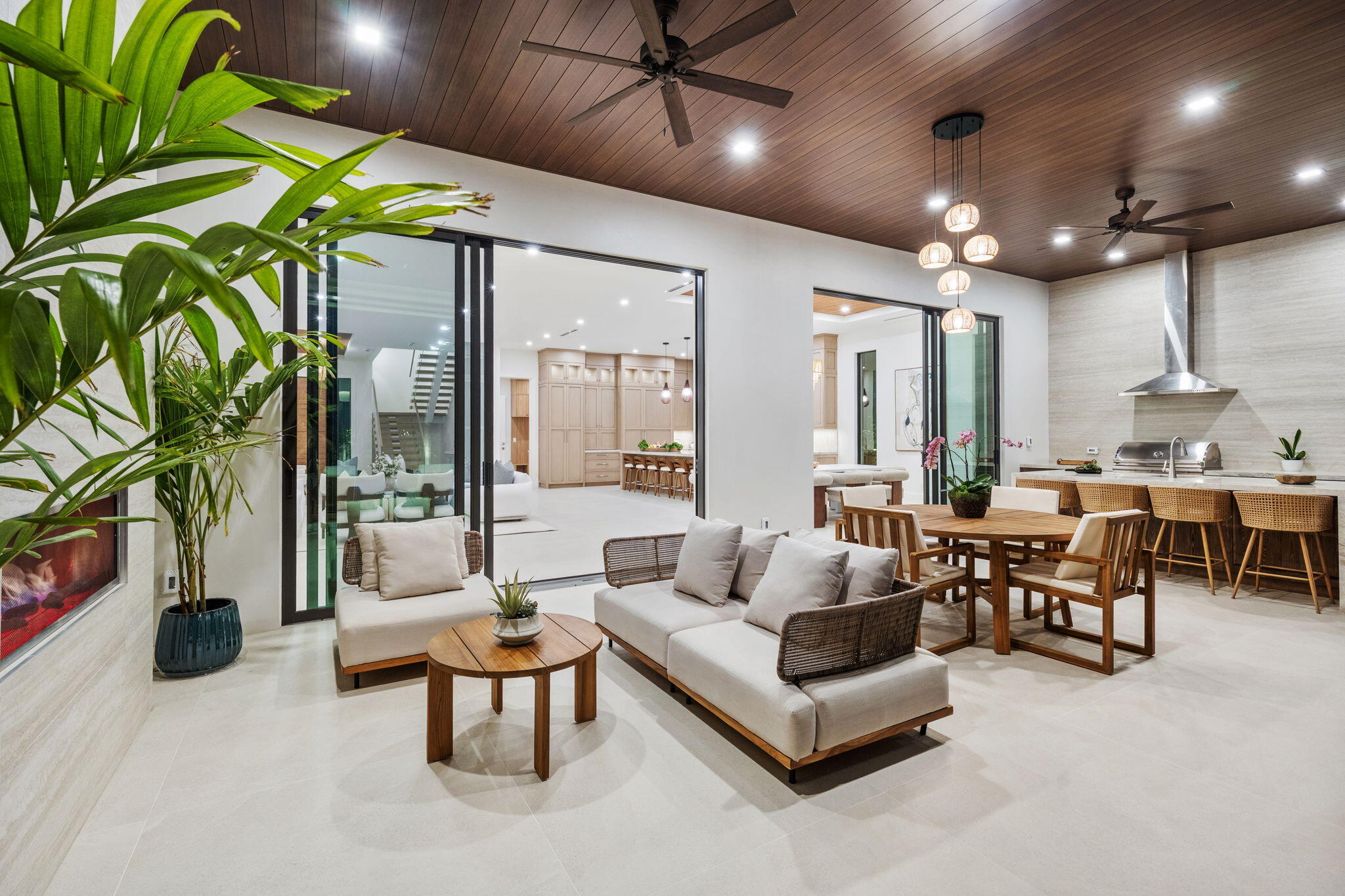 247 Seville Road West Palm Beach, FL 33405 - Photo 6 of 65 a living room with patio furniture and a potted plant