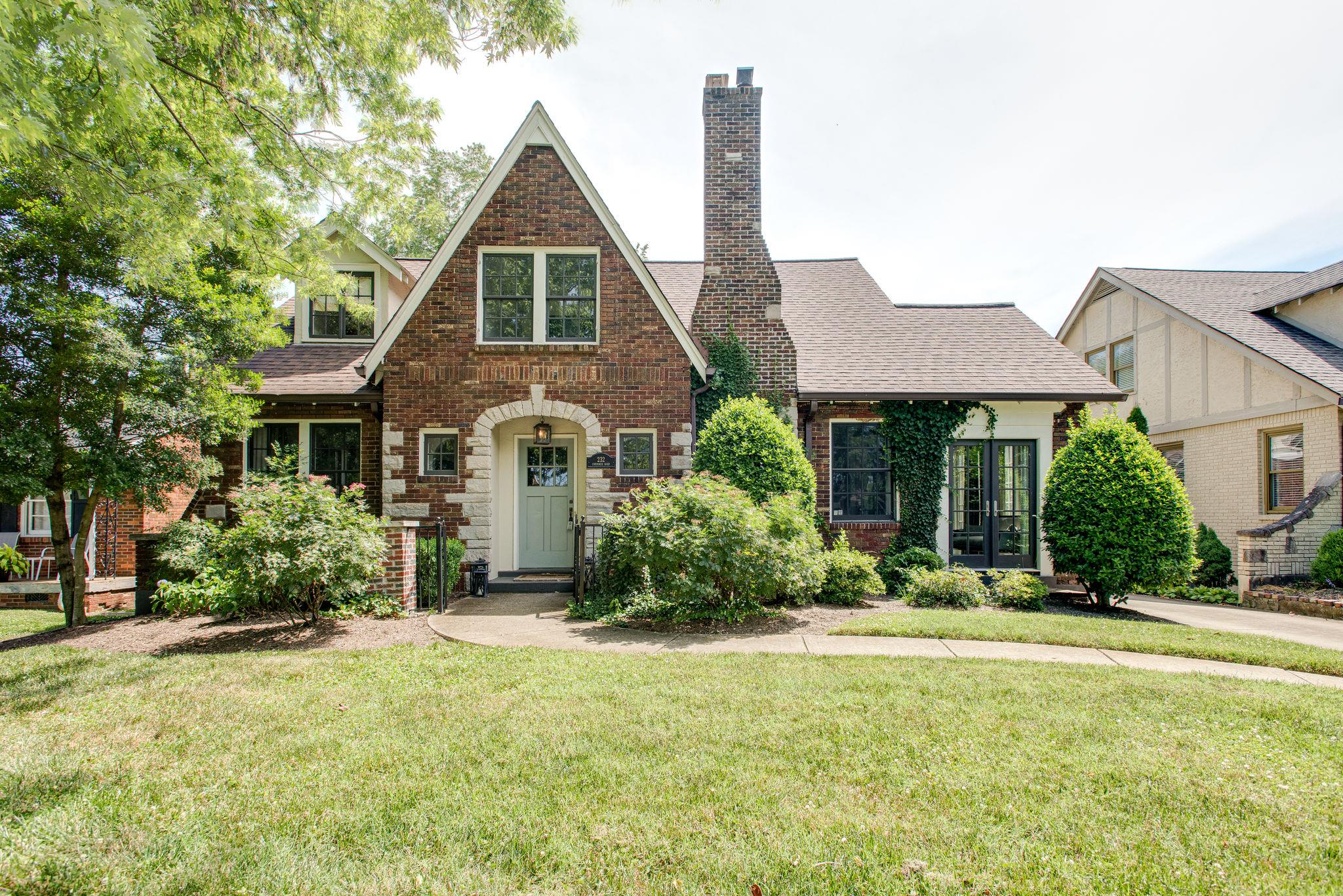 232 Cherokee Road Nashville, TN 37205 - Photo 1 of 24 a front view of a house with yard and green space