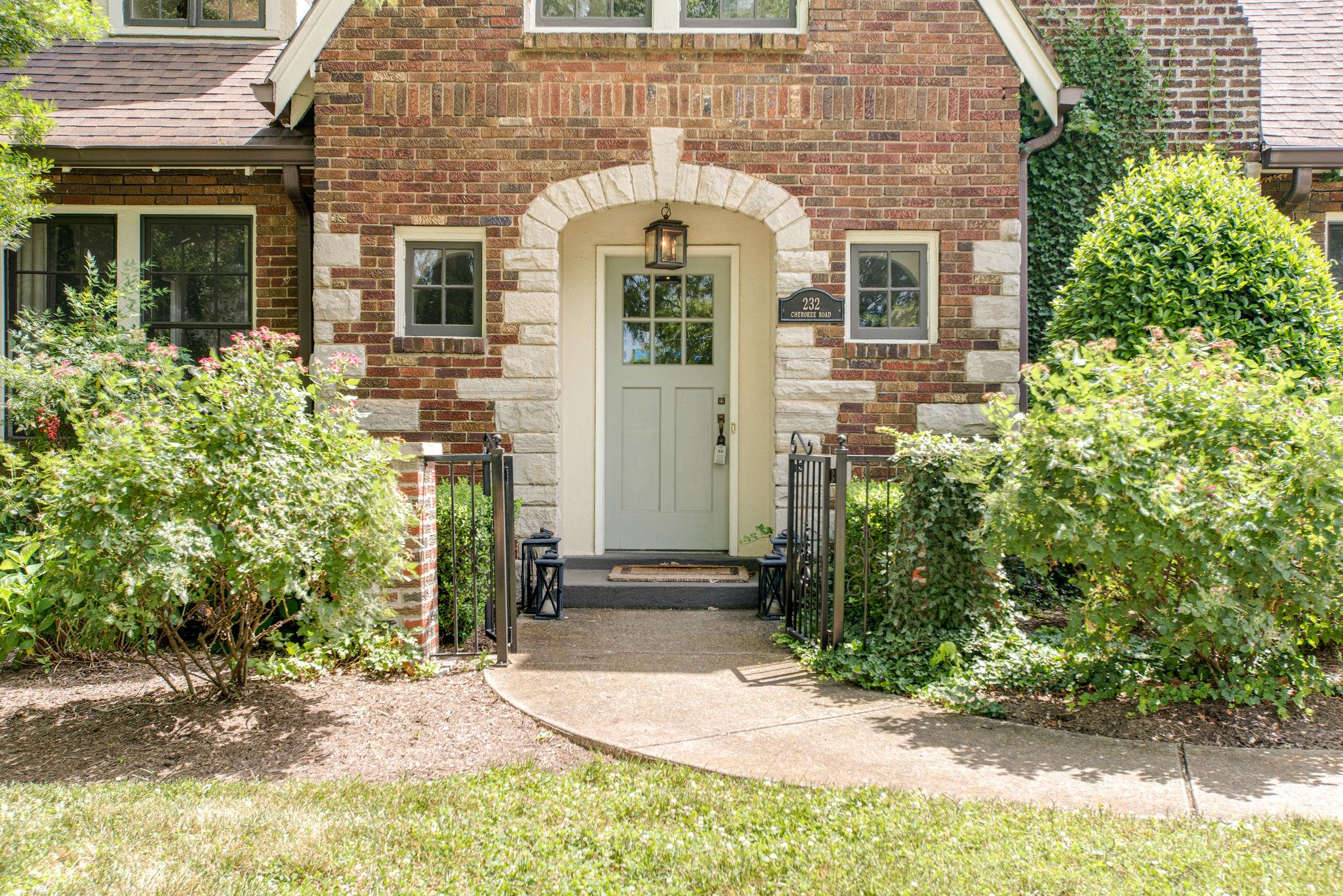 232 Cherokee Road Nashville, TN 37205 - Photo 2 of 24 front view of a brick house with a yard